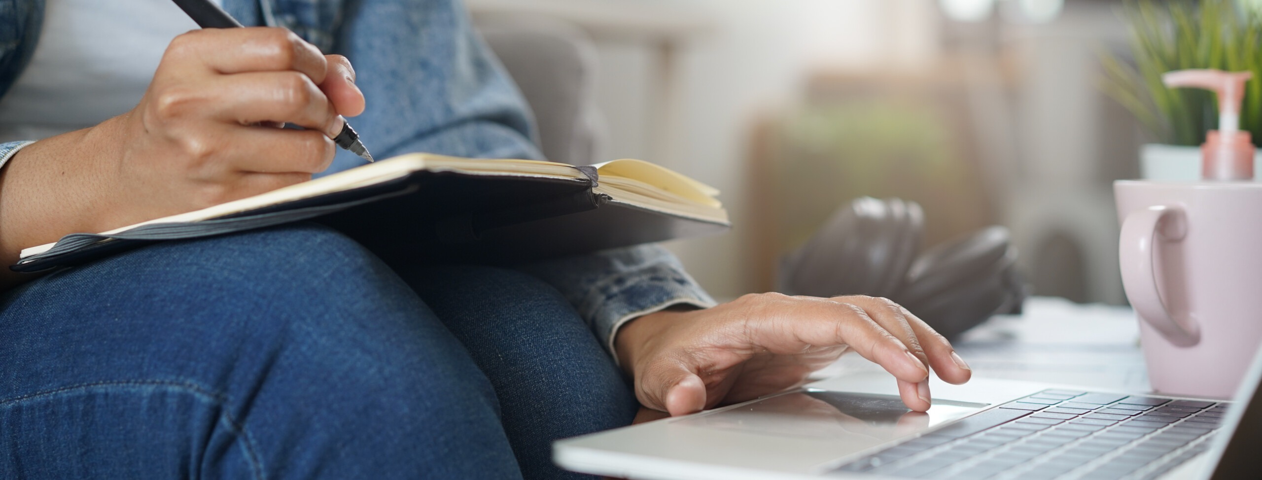 Asian people study online course via internet. Young girl watching business lesson from laptop computer and note lecture to notebook at home.