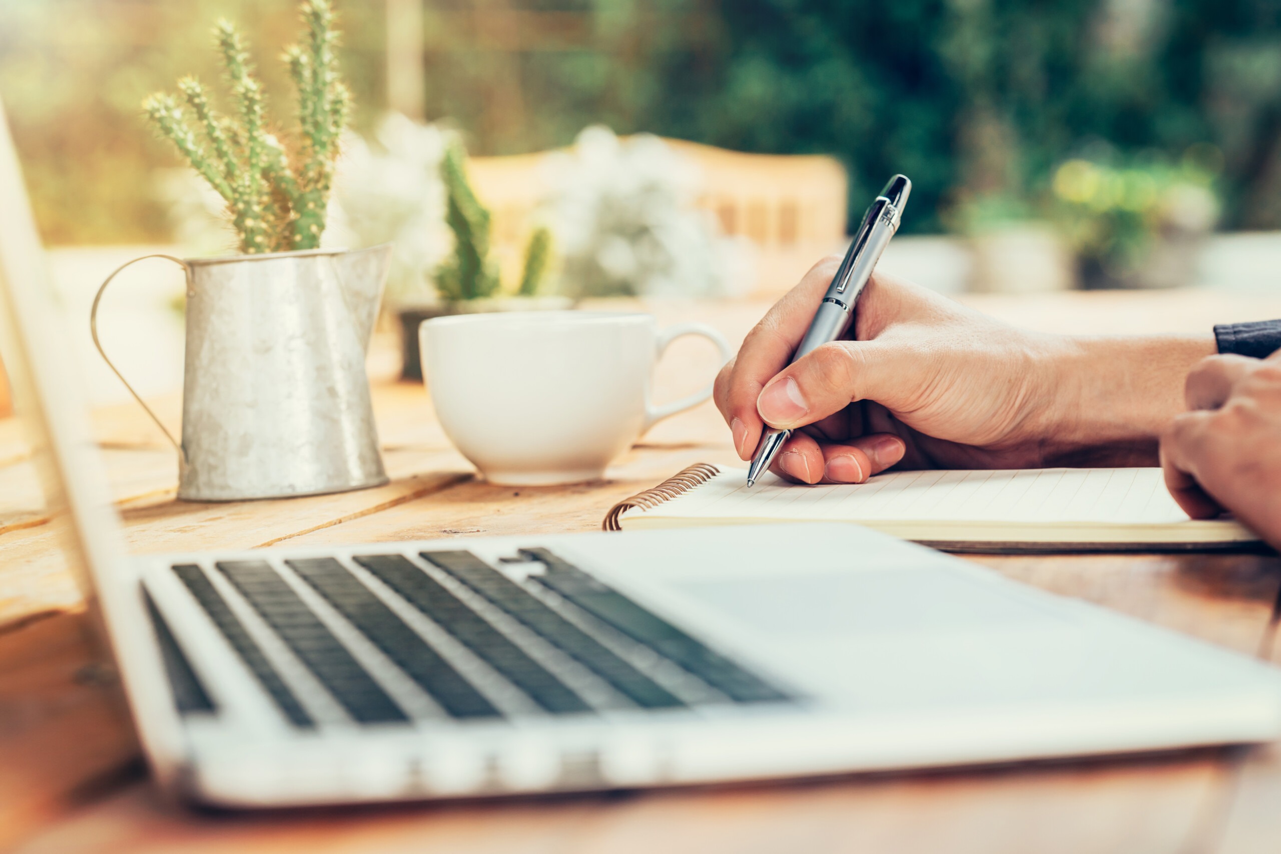 Asia man hand writing notebook paper on wood table in coffee sho Writing Stock photos by Vecteezy