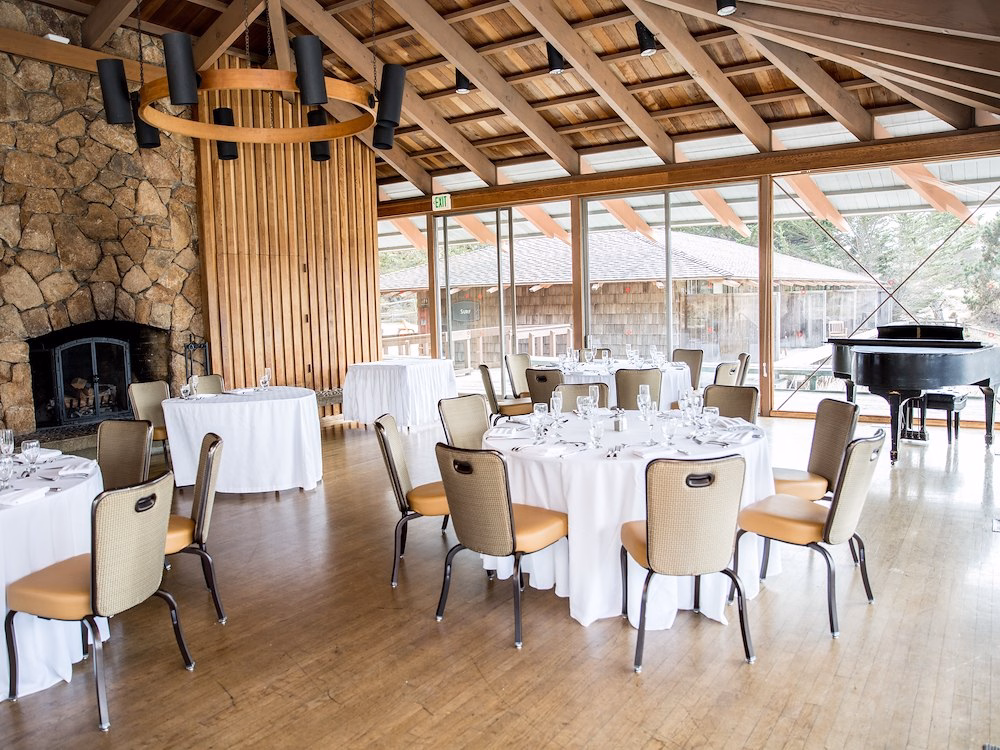 elegant-dining-room-with-round-tables-draped-in-white-cloths-asilomar-hotel-and-conference-grounds-pacific-grove-california
